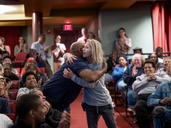 Two Davidson employees hug at Employee Appreciation ceremony