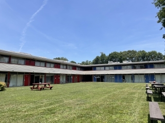 a large apartment complex with a courtyard in the center