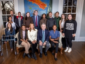 Trustee Carlos Alvarez surrounded by Davidson College Alvarez Scholars and President Doug Hicks