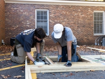 Students building tiny house