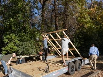 Lifting tiny house frame into place