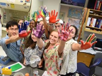 Group of students with painted hands
