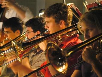 Horns during music performance by Bill Giduz