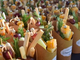 Catering charcuterie cups with cheese and bread sticks