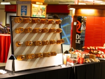 Catering donuts on a wooden serving board