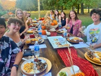 Dinner event with students at a table at The Farm