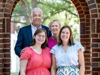 a white family consisting of a male, female and their daughters