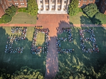 a group of students in the shape of "2028"