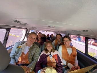 a group of students in a van together