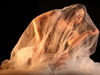 a student performing dance with silk