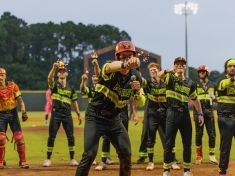 Parker Nolan ’22 with the Firefighters Baseball Team holding sparklers