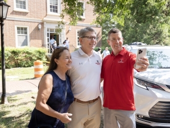 Doug takes selfie with parents