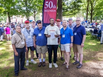 Group of alums and a student (center) at 50th Reunion