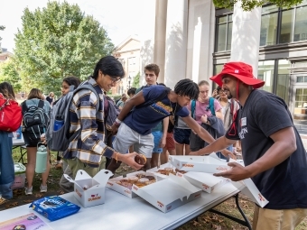 Daniel Heath serving students at Chaplains' Cafe