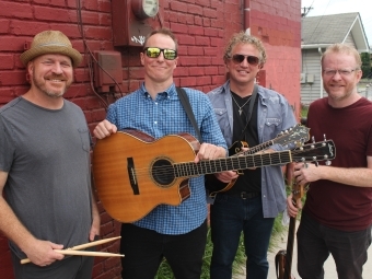 Cast Iron Filter poses with instruments