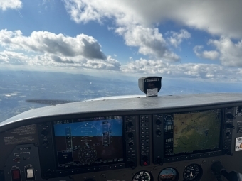 a view from a plane's cockpit on a sunny day