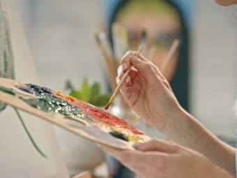 Artist painting with palette