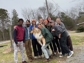 Group of scholar-farmers alongside Farm Manager Halle Murphy and her dog, Onion