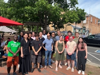 Student researchers outdoors with Professors