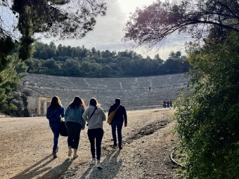 Davidson College students from thelasses 2024 and 2025 approach the Theatre at Epidaurus, Greece