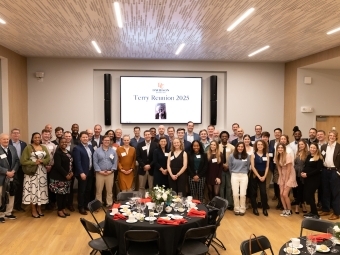 Terry Scholars’ Reunion 2025 in front of screen