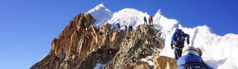 People climb mountain in Bolivia that is covered in ice