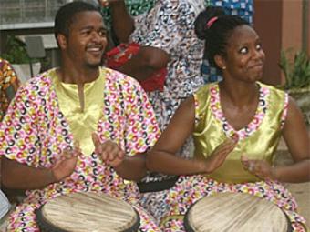 V.J. Brown '15 and Christi Moore '15 playing the drums in Ghana